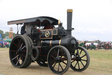 Fototapeta na wymiar Steam Traction engine in a field