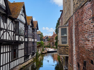 Fototapeta na wymiar Typical buildings overlooking the Stour river in Canterbury, Kent, England, UK