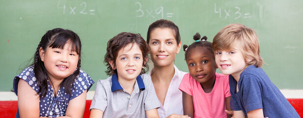 Children at elementary school with their female teacher