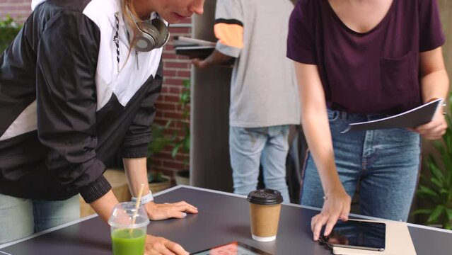 Team, designer and collaboration work in office on project, strategy or product. Group, design and teamwork with diversity working on vision, goal or research, in workshop thinking of idea in meeting