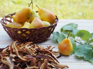 Natural background with dried fruits. Juicy fragrant pears against the backdrop of nature and dried...