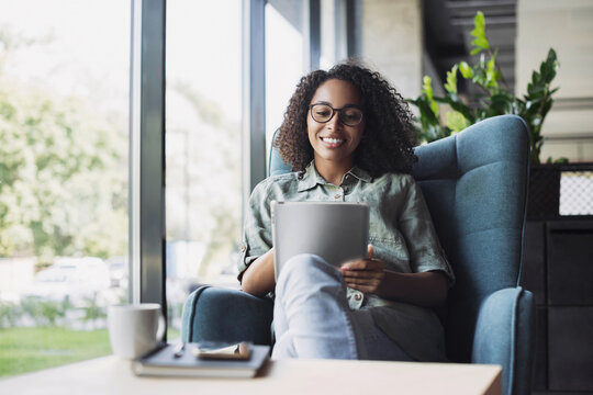 Businesswoman Using Digital Tablet In Modern Office. Young Student Woman Has Coffee Break At Cafe. Communication, Business Casual, Lifestyle, Work Or Study Connection, Mobile Apps, Technology Concept