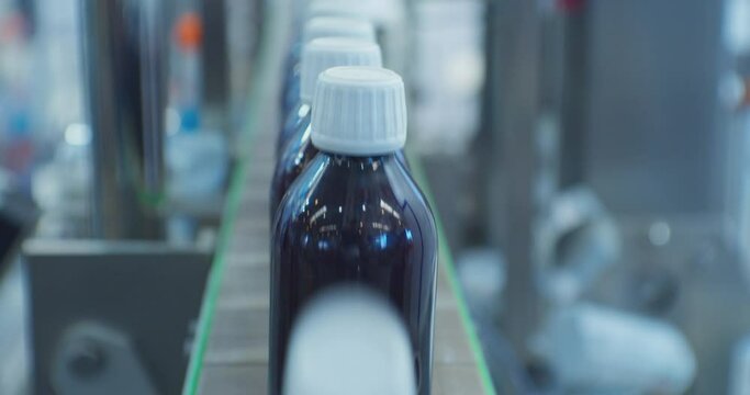 closed plastic bottles move along the conveyor.close-up.