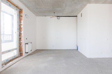 interior of the apartment without decoration in gray colors