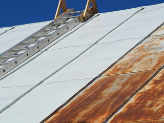 Painting a rusty metal roof. Renovation of galvanized metal roofs. Paints for galvanized metal surfaces