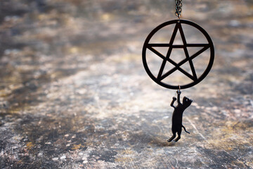 Pentagram necklace with small black cat pendant - obrazy, fototapety, plakaty