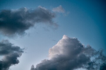 White clouds in the summer sky. Cloudscape background. Concept of climate change.