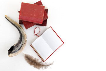 Shofar (horn), book and feather pen. Jewish holiday of Yom Kippur - day of fasting, repentance and...