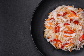 A delicious fresh vegetarian salad of white cabbage, carrot and paprika