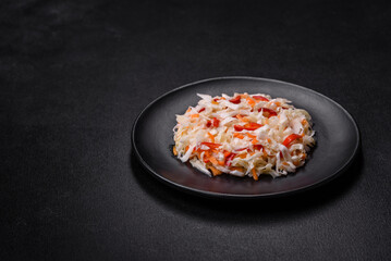 A delicious fresh vegetarian salad of white cabbage, carrot and paprika