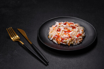 A delicious fresh vegetarian salad of white cabbage, carrot and paprika