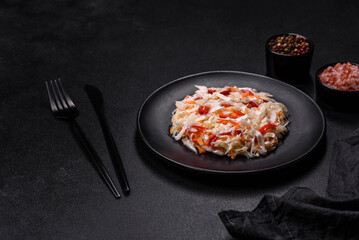 A delicious fresh vegetarian salad of white cabbage, carrot and paprika
