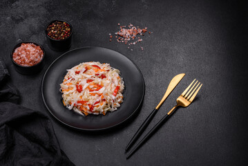A delicious fresh vegetarian salad of white cabbage, carrot and paprika