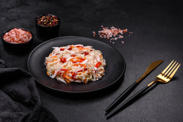 A delicious fresh vegetarian salad of white cabbage, carrot and paprika