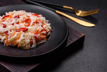 A delicious fresh vegetarian salad of white cabbage, carrot and paprika