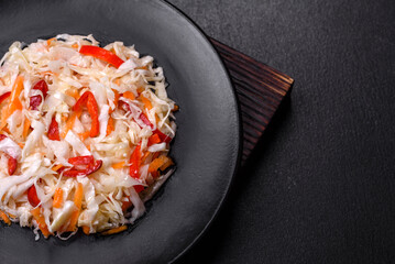 A delicious fresh vegetarian salad of white cabbage, carrot and paprika