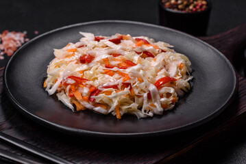 A delicious fresh vegetarian salad of white cabbage, carrot and paprika