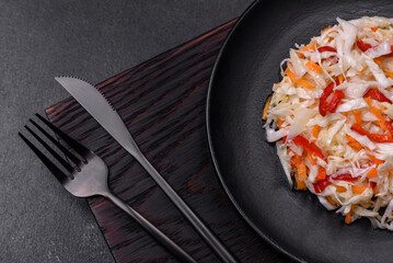 A delicious fresh vegetarian salad of white cabbage, carrot and paprika