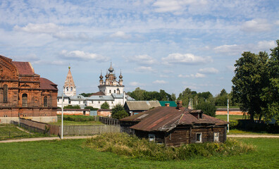 Panoramic view of the old town of Yuriev-Polsky in the Vladimir region with ancient churches and houses among the green grass on a sunny summer day