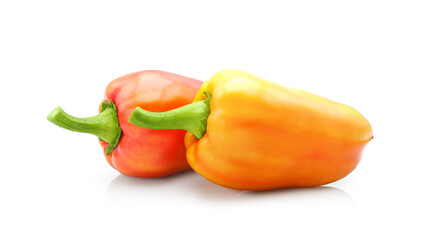 Two colorful red and yellow sweet bell pepper isolated on white background