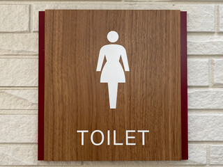 トイレ案内表示板。女性。