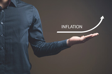 INFLATION and up arrow. The concept of rising inflation.