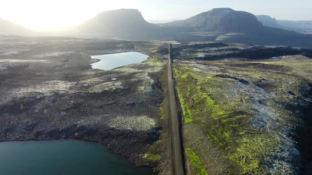 Road landscape in Iceland, beautiful volcanic nature in sunny weather, travel destination gravel f road