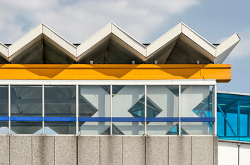 Fototapeta na wymiar Rotterdam, The Netherlands, September 22, 2022: detail of Slinge metro station with the characteristic ww-shaped roof and XX-shaped columns of the early stations