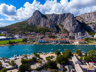 aerial view of the town of omiš in croatia, a picturesque town on the adriatic coast with the...