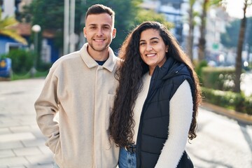 Man and woman couple smiling confident standing together at park