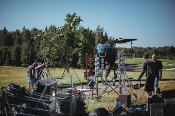 Film crew, lighting devices, monitors, playbacks - filming equipment and a team of specialists in...