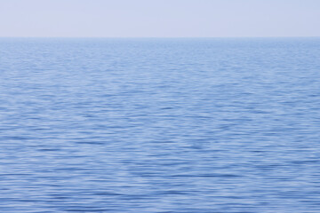 Obraz premium Seascape with calm water surface, the concept of rest and relaxation