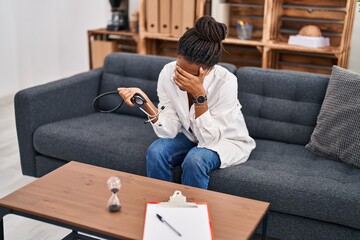 African american woman doctor patient stressed having psychology session at psychology center