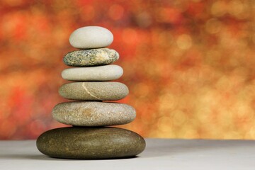 Balance of stones of natural origin isolated on the background of bokeh.