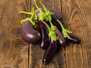 Fresh eggplant on a wooden background close-up