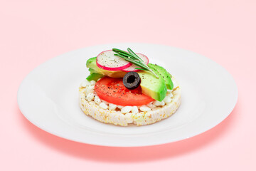 Rice Cake Sandwich with Avocado, Tomato, Cottage Cheese, Olives and Radish on White Plate. Easy Breakfast. Diet Food. Quick and Healthy Sandwiches. Crispbread with Tasty Filling. Healthy Dietary Snack