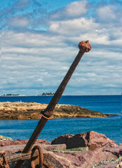 rusty anchor on the beach