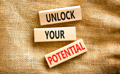 Unlock your potential symbol. Concept words Unlock your potential on wooden blocks. Beautiful canvas table canvas background. Business, psychological unlock your potential concept. Copy space.