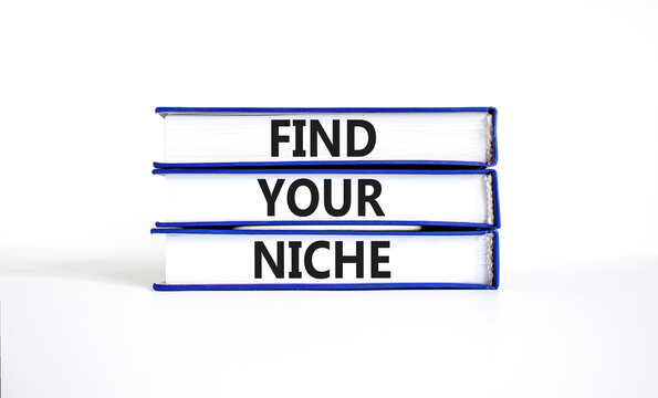 Find your niche symbol. Concept words Find your niche on books. Beautiful white table white background. Business and find your niche concept. Copy space.