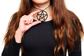 Lady in black showing a large pentagram necklace