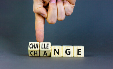 Challenge and change symbol. Concept words Challenge and Change on wooden cubes. Businessman hand....