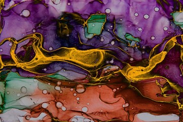 Areas covered with golden dust on Alcohol ink fluid abstract texture fluid art with gold glitter and liquid.