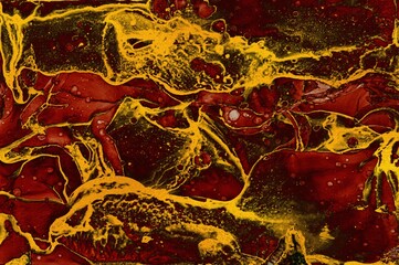 Thick and thin lines of golden dust on Alcohol ink fluid abstract texture fluid art with gold glitter and liquid.