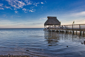 bungalow, sea, water, ocean, sunset, sky, island, tropical, travel, nature, landscape, vacation, paradise, hut, pier, roatan, roatan island, roatan honduras, caribbean island, caribbean, colorful suns