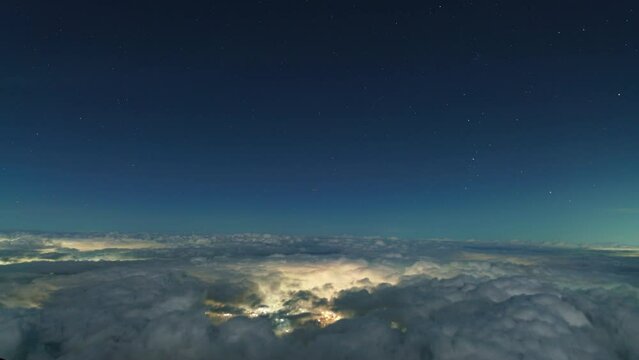 Time lapse of night sky over sea of clouds shot from top of Mt. Fuji in Japan
