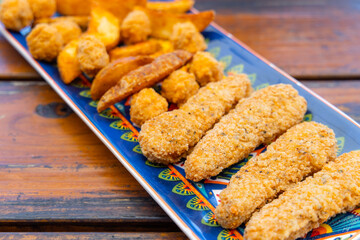 Fry fish finger and potato wedges