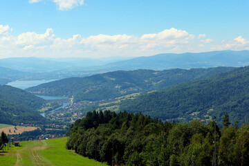Fototapeta premium Panoramic view from Zar Mountain, Poland. View of Beskidy Mountains, Zywieckie Lake. Small Beskid region of Poland