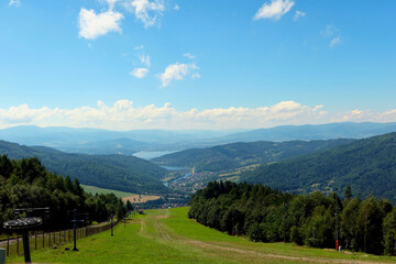 Obraz premium Panoramic view from Zar Mountain, Poland. View of Beskidy Mountains, Zywieckie Lake. Small Beskid region of Poland