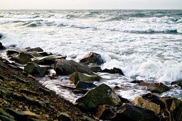 ocean waves breaking on rocks on the beach of sao luis do maranhão, brazil