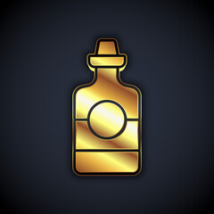 Gold Tequila bottle icon isolated on black background. Mexican alcohol drink. Vector